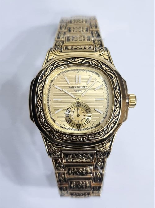 Patek philippe nautilus hand engraved price discount